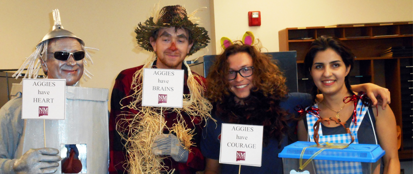 Faculty wearing Wizard of Oz halloween costumes